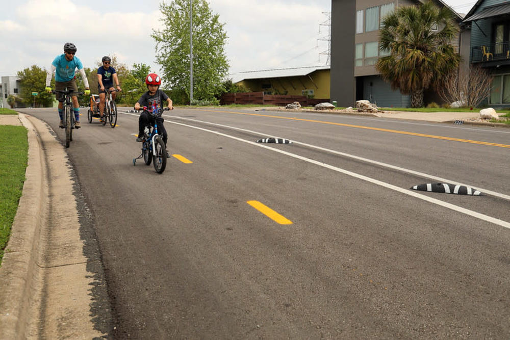 An example of an in-street trail protected with rubber curbs